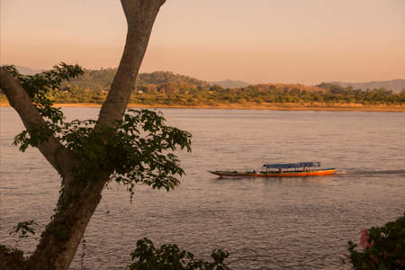 a sunset at the mekong river in the town of Chiang Saen in the north of the city Chiang Rai in North Thailand.   Thailand, Chiang Sean, November, 2019のeditorial素材