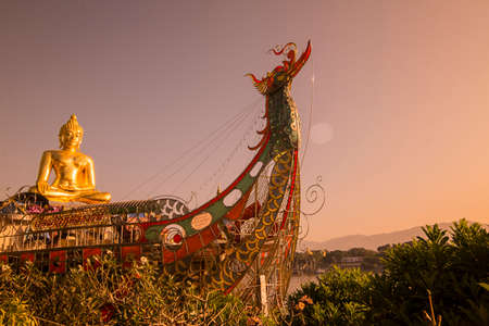 the Giant Buddha on the Dragon Boat Temple at the Mekong River in the town of Sop Ruak in the golden triangle in the north of the city Chiang Rai in North Thailand.   Thailand, Chiang Sean, November, 2019のeditorial素材