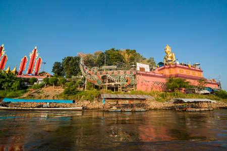 the Giant Buddha on the Dragon Boat Temple at the Mekong River in the town of Sop Ruak in the golden triangle in the north of the city Chiang Rai in North Thailand.   Thailand, Chiang Sean, November, 2019のeditorial素材