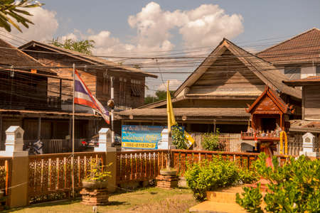 a old wood house at the Trog Bann Chin Alley in the old town of Tak in the Province of Tak in Thailand.   Thailand, Tak, November, 2019のeditorial素材