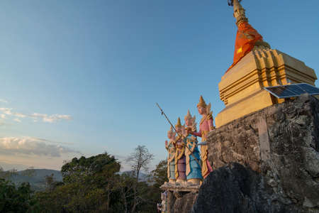 a Temple Shrine of a Monk from Myanmar on a Top of a Rock on the Thailand and Myanmar Border near the Phra That  Doi Din Chi near the town of Mae Sot in the Province of Tak in Tahiland.   Thailand, Mae Sot, November, 2019のeditorial素材