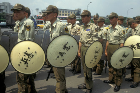 Police and Security on the streets in the city centre of Taipei in Taiwan of East Aasia.   Taiwan, Taipei, May, 2001のeditorial素材