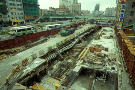 a construction site of a Metro station on the zhongxiao road or Chunghsiao Road in the city centre of Taipei in Taiwan of East Aasia.   Taiwan, Taipei, July, 1997のeditorial素材
