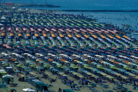 umbrellas or parasol at a public beach in Rimini in Emilia-Romagna in Italy.   Italy, Rimini, June, 2001のeditorial素材