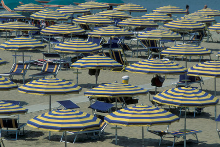 umbrellas or parasol at a public beach in Rimini in Emilia-Romagna in Italy.   Italy, Rimini, June, 2001のeditorial素材
