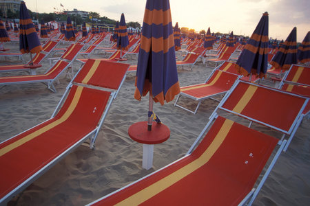 umbrellas or parasol at a public beach in Rimini in Emilia-Romagna in Italy.   Italy, Rimini, June,...