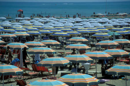 umbrellas or parasol at a public beach in Rimini in Emilia-Romagna in Italy.   Italy, Rimini, June, 2001のeditorial素材