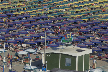 umbrellas or parasol at a public beach in Rimini in Emilia-Romagna in Italy.   Italy, Rimini, June, 2001のeditorial素材