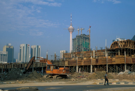 a large construction side in the city of Kuala Lumpur in Malaysia.  Malaysia, Kuala Lumpur, August, 1997のeditorial素材
