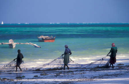 Fishermen on the Beach at the East Coast at the Village of Bwejuu on the Island of Zanzibar in Tanzania.  Tanzania, Zanzibar, Bwejuu, October, 2004のeditorial素材