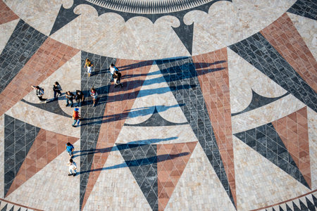 People walk on the giant world Map Mosaic or pavement at the Padrao dos Descobrimentos in Belem near the City of Lisbon in Portugal.  Portugal, Lisbon, October, 2021のeditorial素材