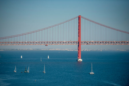 the Ponte 25 de Abril or 25the April Bridge at the Rio Tejo near the City of Lisbon in Portugal. ...