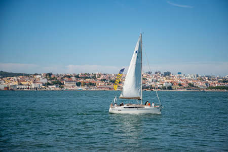 a sailboat at the Rio Tejo near the City of Lisbon in Portugal.  Portugal, Lisbon, October, 2021のeditorial素材