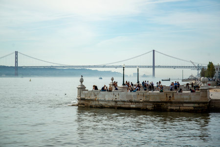 the Ponte 25 de Abril or 25the April Bridge at the Rio Tejo near the City of Lisbon in Portugal. ...