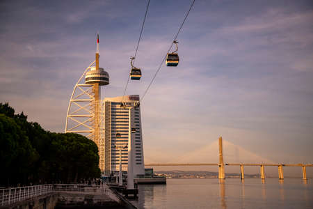 The Vasco da Gama Tower and Cablecar with the Ponte Vasco da Gama in Oriente near the City of Lisbon in Portugal.  Portugal, Lisbon, October, 2021のeditorial素材