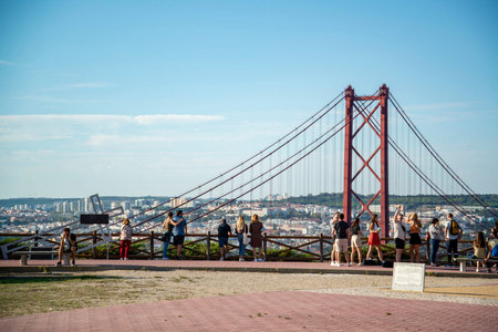 the Ponte 25 de Abril or 25the April Bridge at the Rio Tejo near the City of Lisbon in Portugal.  Portugal, Lisbon, October, 2021のeditorial素材