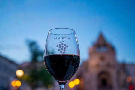 a glas of wine at the Parca da Republica with the Largo de Santa Clara in the old town in the city of Elvas in Alentejo in Portugal.  Portugal, Elvas, October, 2021のeditorial素材