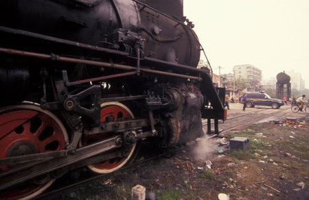 a steam Locomotive Train in the City of Wuhan in the Province of Hubei in China.  China, Wuhan, November, 1996のeditorial素材