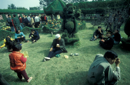 people at the Park in the Memorial Temple to Lord Bao in the City of Kaifeng in the Province of Henan in China. China, Kaifeng, November, 1996のeditorial素材