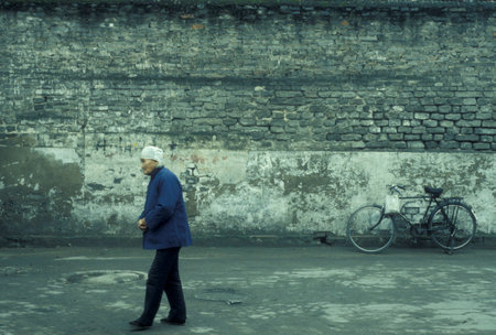 a bicycle on a street in the City of Kaifeng in the Province of Henan in China. China, Kaifeng, November, 1996のeditorial素材