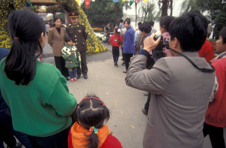 people at the Park in the Memorial Temple to Lord Bao in the City of Kaifeng in the Province of Henan in China. China, Kaifeng, November, 1996のeditorial素材