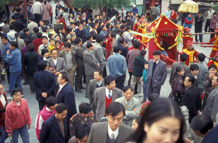 street life in a small alley in the old town in the City of Kaifeng in the Province of Henan in China. China, Kaifeng, November, 1996のeditorial素材