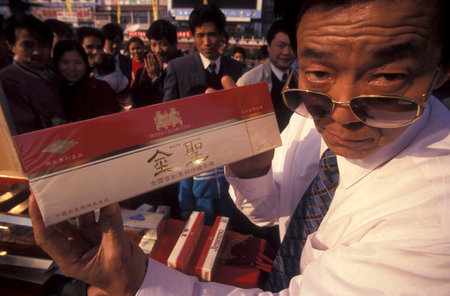 a cigarette promotion at an Alcohol and Tabac Fair in the City of Nanchang in the Province of Jiangxi in China. China, Nanchang, November, 1996のeditorial素材