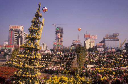 the city square and park at an Alcohol and Tabac Fair in the City of Nanchang in the Province of Jiangxi in China. China, Nanchang, November, 1996のeditorial素材