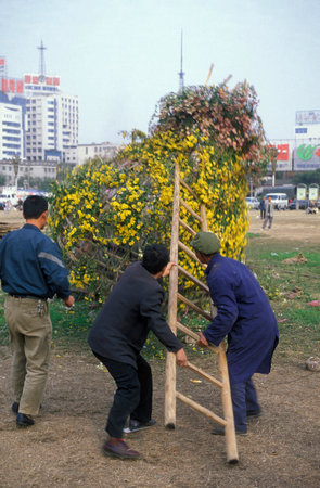 the city square and park at an Alcohol and Tabac Fair in the City of Nanchang in the Province of Jiangxi in China. China, Nanchang, November, 1996のeditorial素材