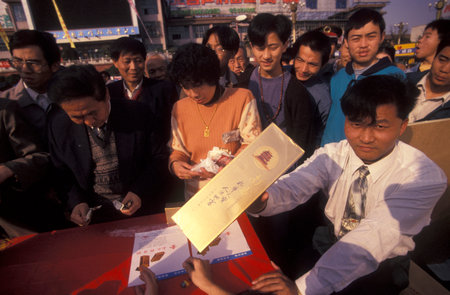a cigarette promotion at an Alcohol and Tabac Fair in the City of Nanchang in the Province of Jiangxi in China. China, Nanchang, November, 1996のeditorial素材