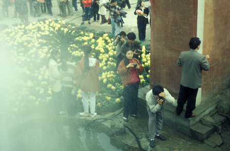 people at the Park in the Memorial Temple to Lord Bao in the City of Kaifeng in the Province of Henan in China. China, Kaifeng, November, 1996のeditorial素材