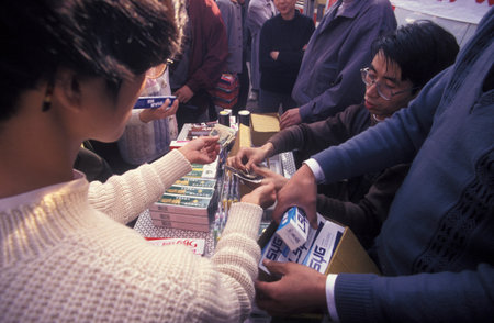 a toothpaste promotion at an Alcohol and Tobacco Fair in the City of Nanchang in the Province of Jiangxi in China. China, Nanchang, November, 1996のeditorial素材