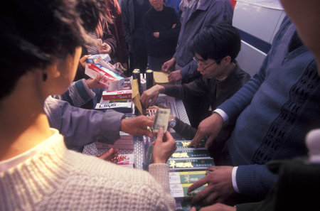 a toothpaste promotion at an Alcohol and Tobacco Fair in the City of Nanchang in the Province of Jiangxi in China. China, Nanchang, November, 1996のeditorial素材