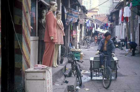 a street market in the City of Nanchang in the Province of Jiangxi in China. China, Nanchang, November, 1996のeditorial素材