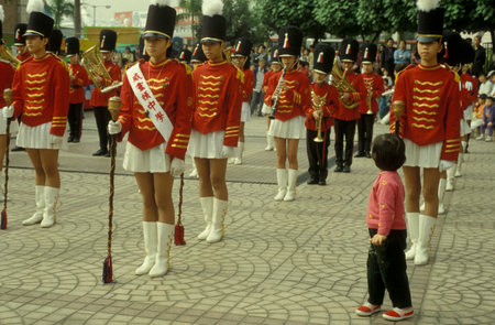traditional British Uniforms at a show on the waterfront of Kowloon in front of the skyline of Hong Kong Central in Hong Kong. Hong Kong, June, 1997のeditorial素材