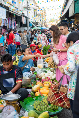 People at Vegetable and Fruit Market at morning market in the city of Phitsanulok in Thailand....