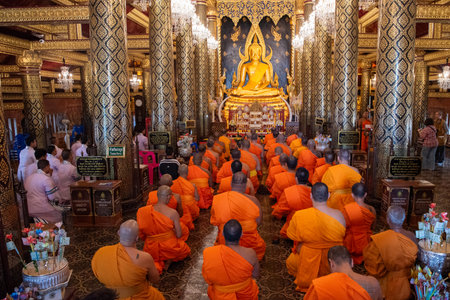 Monks at Wat Phra Si Rattana Mahathat in the city of Phitsanulok in Thailand. Thailand, Phitsanulok, December, 1, 2024.のeditorial素材