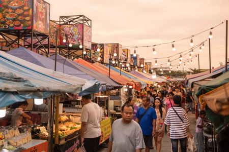 People at Star Night Bazaar with the Art paintings at Night Market in City and Province of Rayong in...