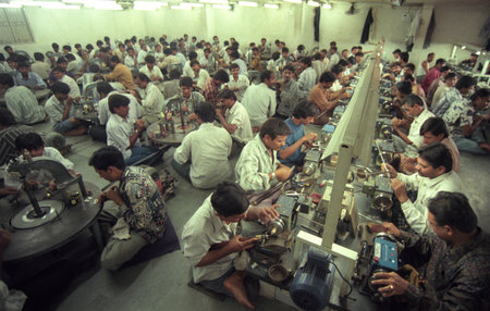 Working people in a factory of gemstone cutting in the city of Jaipur in the province of Rajasthan in India. India, JAIPUR, January, 1998のeditorial素材