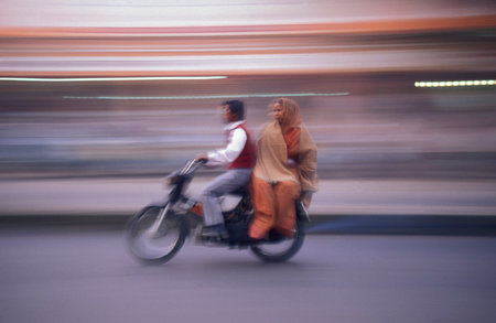 a Motorbike traffic on a road in the City of Jaipur in the Province of Rajasthan in India. India,...