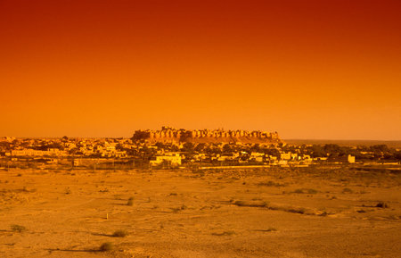 a view of the Jaisalmer Fort with the city of Jaisalmer in the Province of Rajasthan in India....