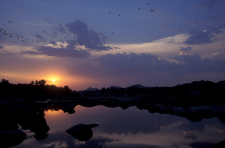the Landscape and River with the typical Stones and Hills around the town of Hampi in the Province of Karnataka in India. India, Karnataka, March, 1998のeditorial素材