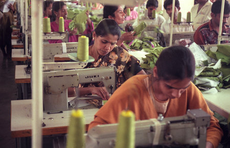 Women at work at a textile and clothing factory in the city of Mysore in the Province of Karnataka in India. India, Mysore, March, 1998のeditorial素材