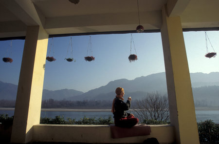 People at a yoga class at the Holy Ganges River in the city of Rishikesh in the Province of...