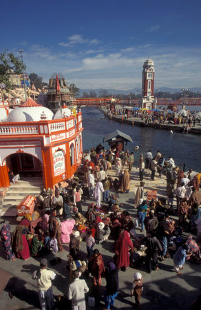 a view over public aerea with the Clock Tower at the Holy Ganges River in the city of Haridwar in the Province of Uttarakhand in India. India, Haridwar, February, 1998のeditorial素材