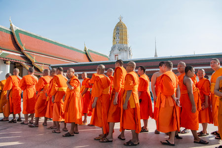 Group of monks visit the Wat Phra Si Rattana Mahathat in the city of Phitsanulok in Thailand....