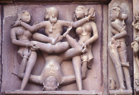 Erotic Sculptures at the erotic Temple or Hindu Temple of Kandarija Mahadeva Temple in the city of Khajurao in Province Madhya Pradesh in India. India, Khajurao, April, 1998のeditorial素材