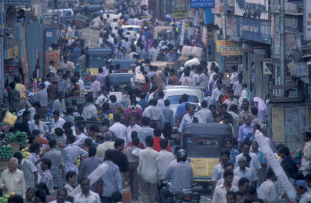 Traffic and pollution with cars, bus amd motorcycle on a mainroad in the city of Chennai in Tamil...