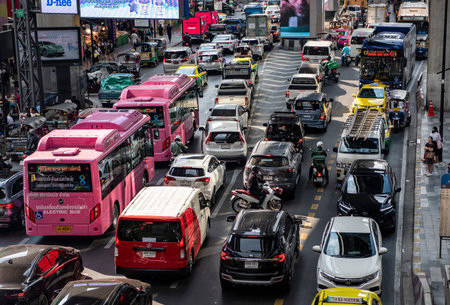 Traffic with cars on the road at the Siam Square in the city of Bangkok in Thailand. Thailand,...