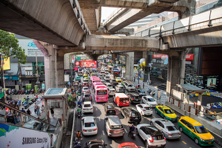 Traffic with cars on the road at the Siam Square in the city of Bangkok in Thailand. Thailand,...